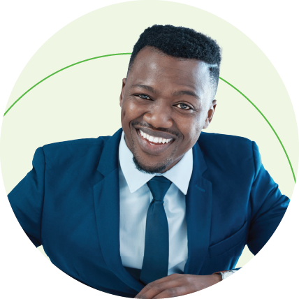 Investment banking professional smartly dressed in a navy blue suit and smiling.